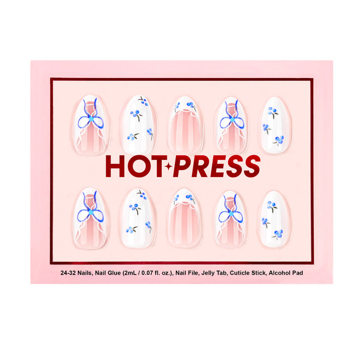 Medium almond press-on nails with a sheer base, featuring vibrant cobalt blue bows, white lace-style French tips, and delicate blueberry illustrations.