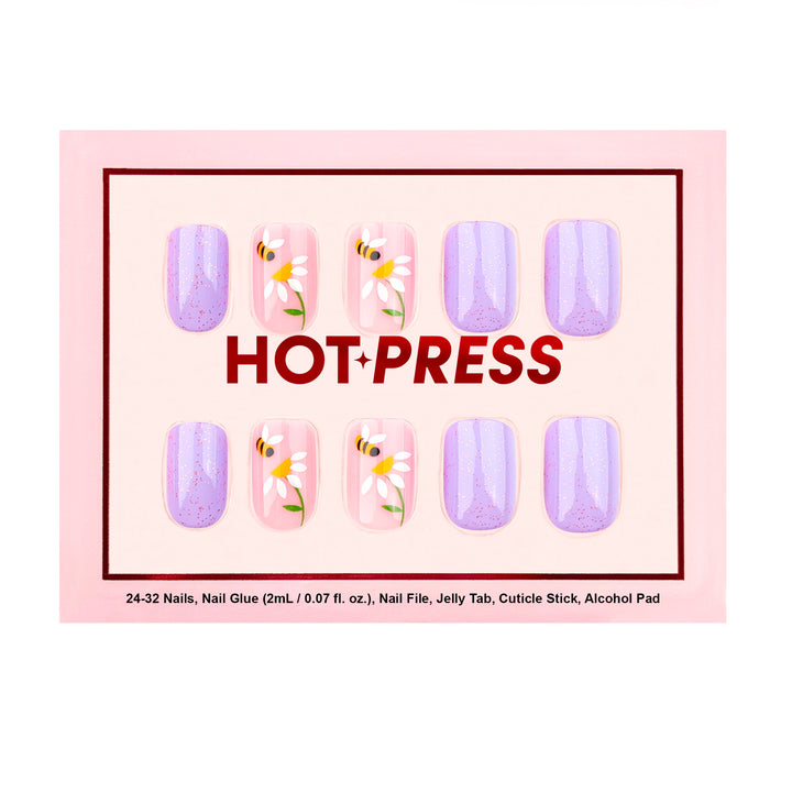Short square press-on nails featuring a mix of shimmering purple glazed nails and sheer-base nails with white daisies and yellow honeybee illustrations.