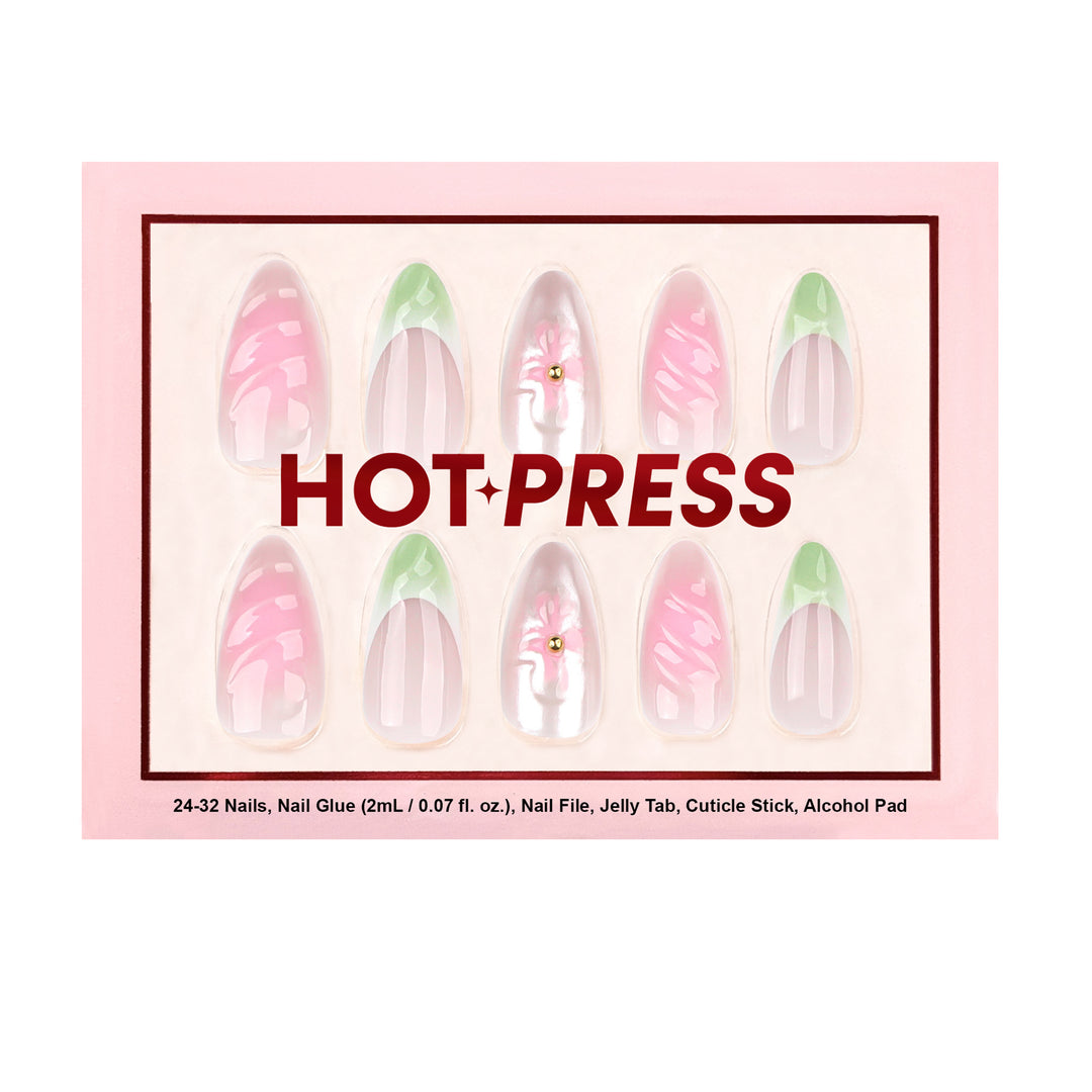 Medium almond press-on nails with a soft pink aura gradient base, featuring sage green French tips and hand-designed 3D pink flowers with gold bead centers.