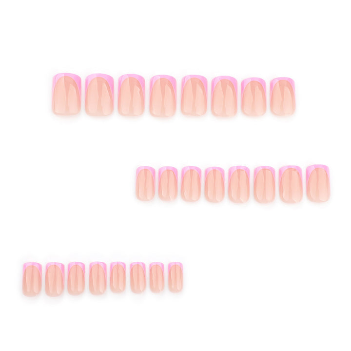 Pink Avenue press-on nails featuring a high-gloss translucent blush pink base with pink French tips covered in sparkling silver and pink glitter.