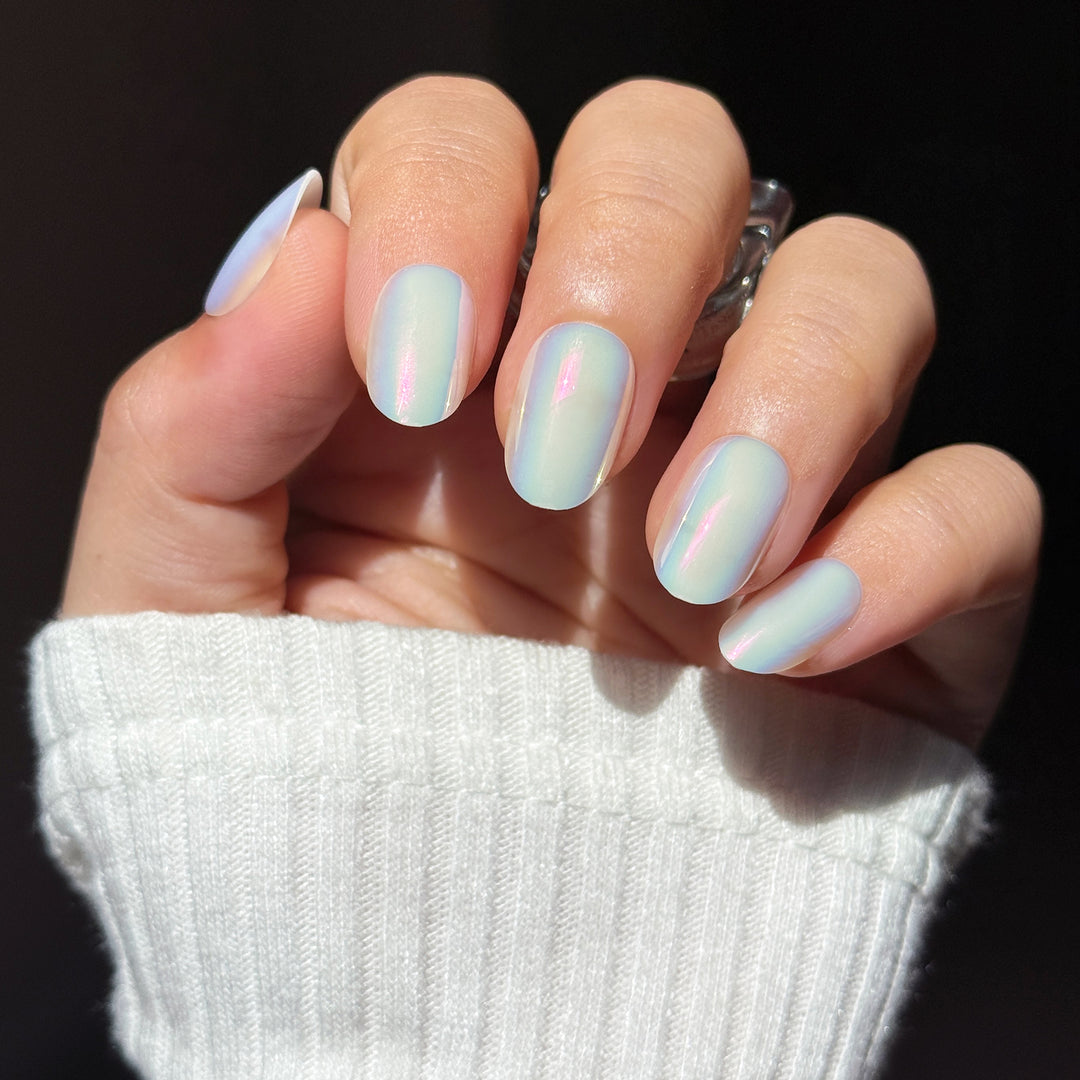Prism short square press-on nails featuring a highly reflective silver base detailed with a blinding, multi-dimensional rainbow holographic laser cat-eye magnetic shimmer.