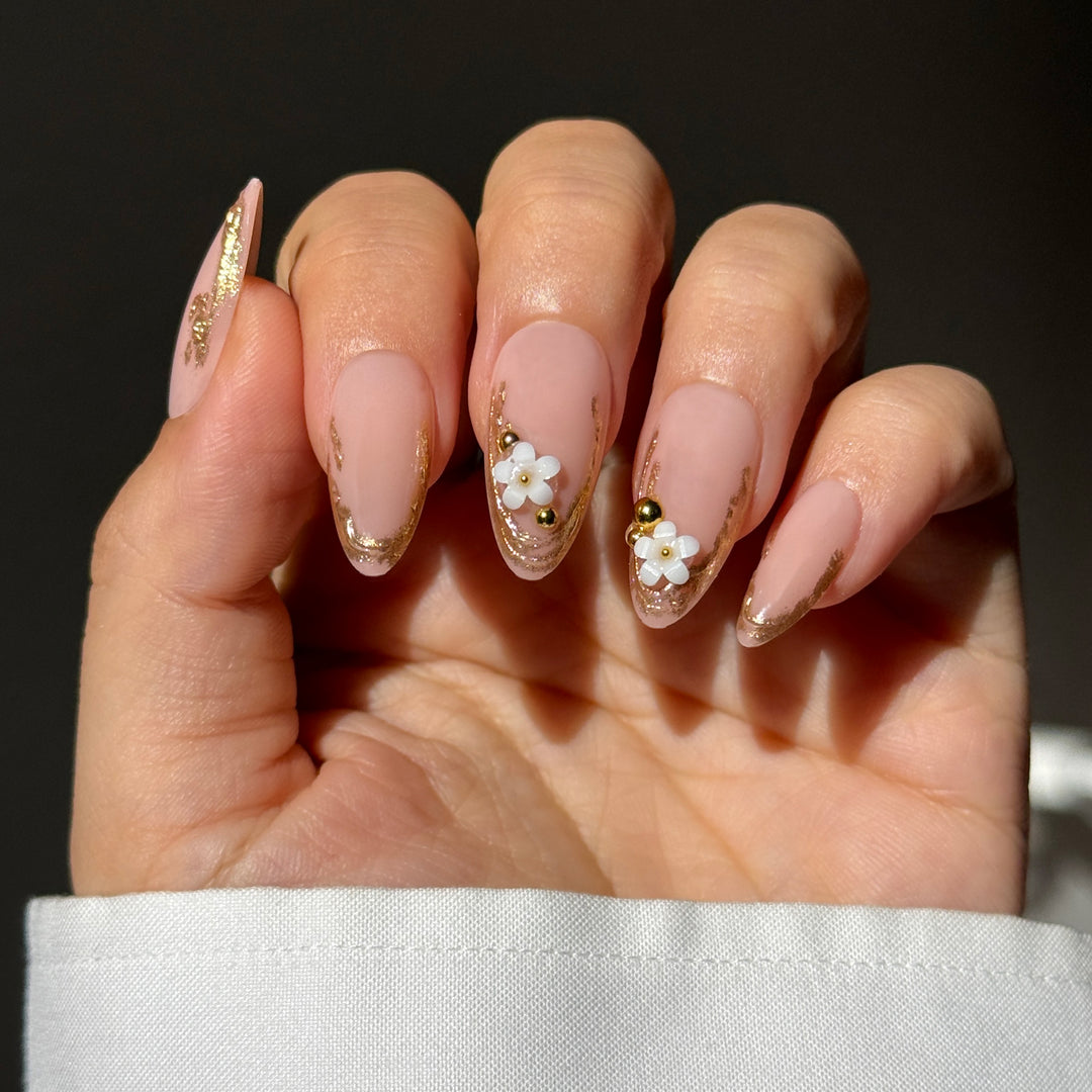 Pure Intentions short oval press-on nails featuring a sheer pink base, micro white French tips, and precise clear 3D raised heart accents.