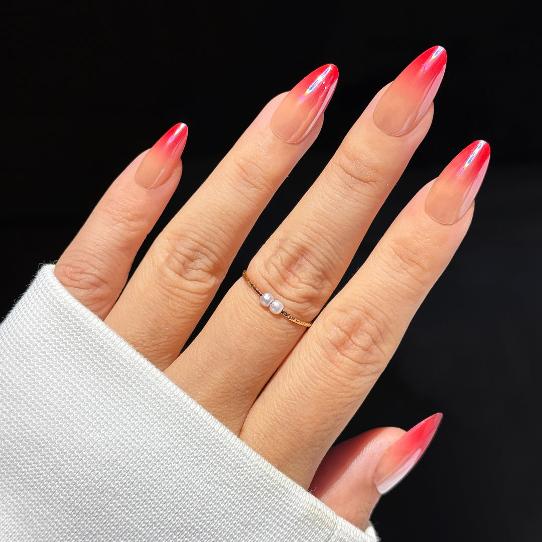Shirley Temple Ombre Almond press-on nails featuring a glossy cherry red gradient fade design.