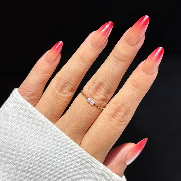 Shirley Temple Ombre Almond press-on nails featuring a glossy cherry red gradient fade design.
