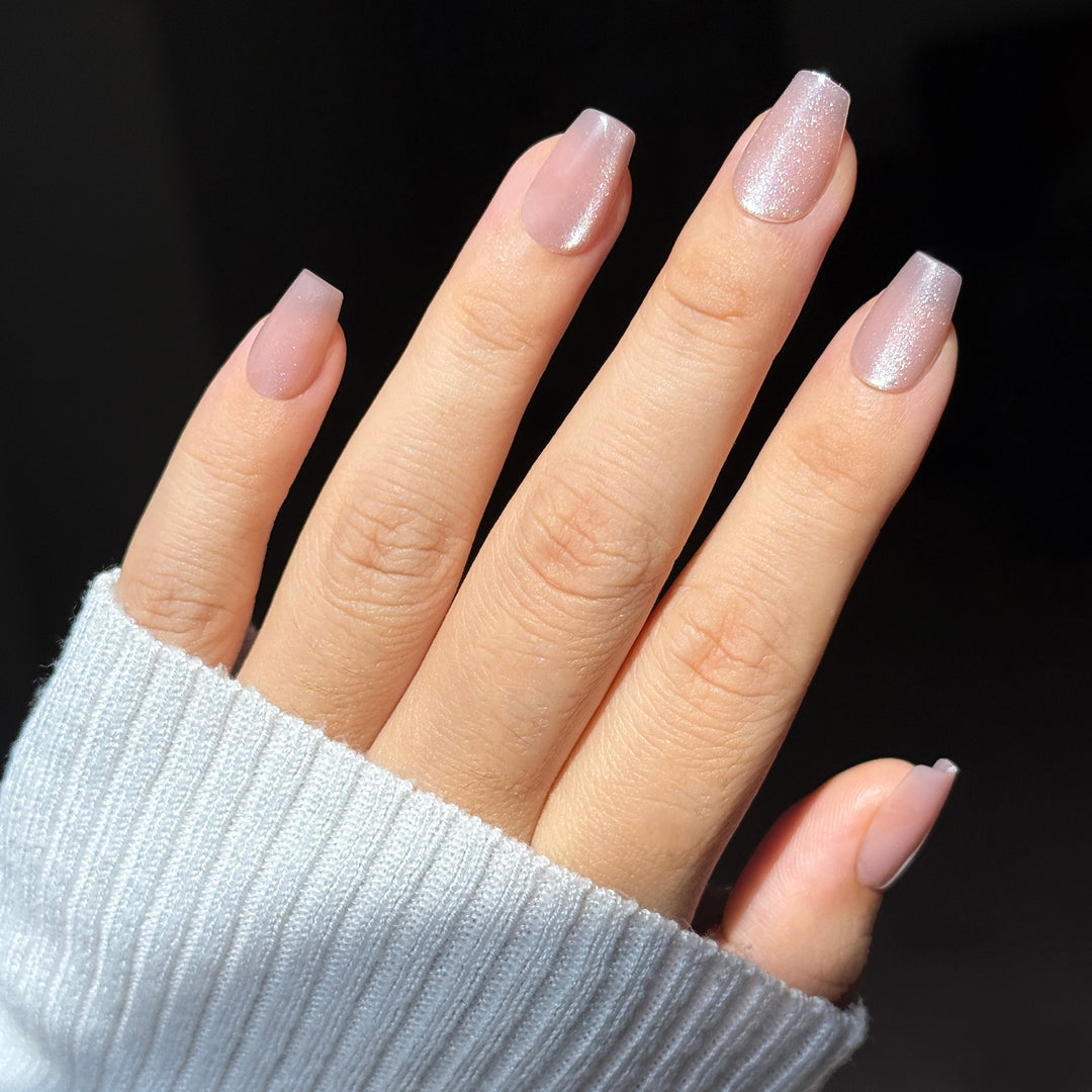 Sugar Spritz short square press-on nails featuring a soft semi-translucent light pink base coat overlaid with a dense reflective silver diamond glitter shimmer finish.