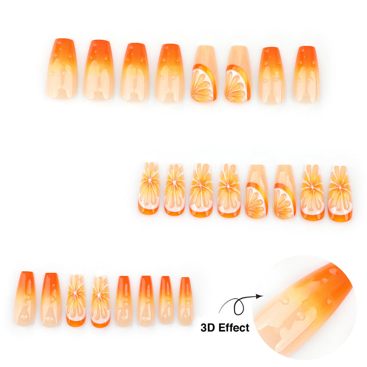 Vibrant orange press-on nails in a coffin shape. The design includes detailed orange fruit slices and an orange ombre effect with raised 3D clear water droplets on the surface.