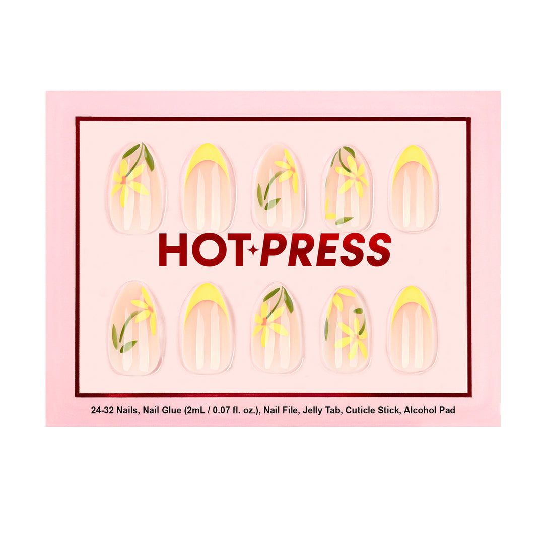 Medium almond press-on nails with a sheer nude base, featuring buttery yellow French tips and hand-drawn yellow daisies with green leaf accents.