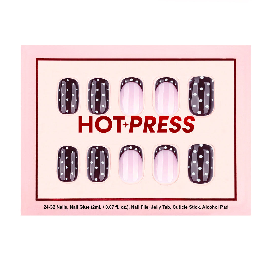 Square press-on nails with a mix of solid black nails with white dots and maroon French tips with white dots.