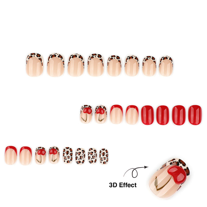 Short oval press-on nails featuring leopard print French tips and solid red nails. Two accent nails show a leopard print tip with a large, raised 3D red cherry design.