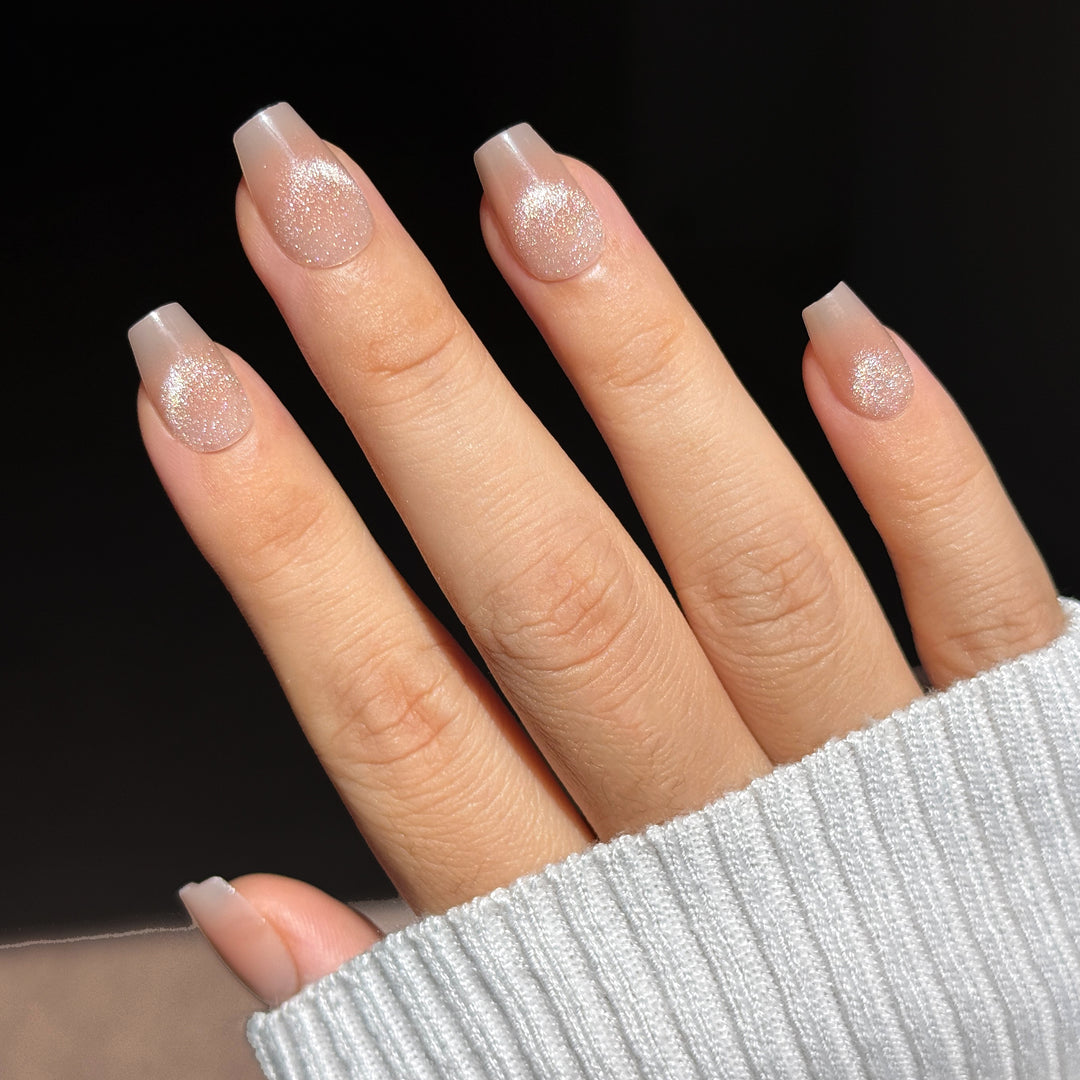 Cashmere Cat-Eye short square press-on nails featuring a soft nude base coat detailed with a highly reflective silver-toned magnetic velvet shimmer flash.