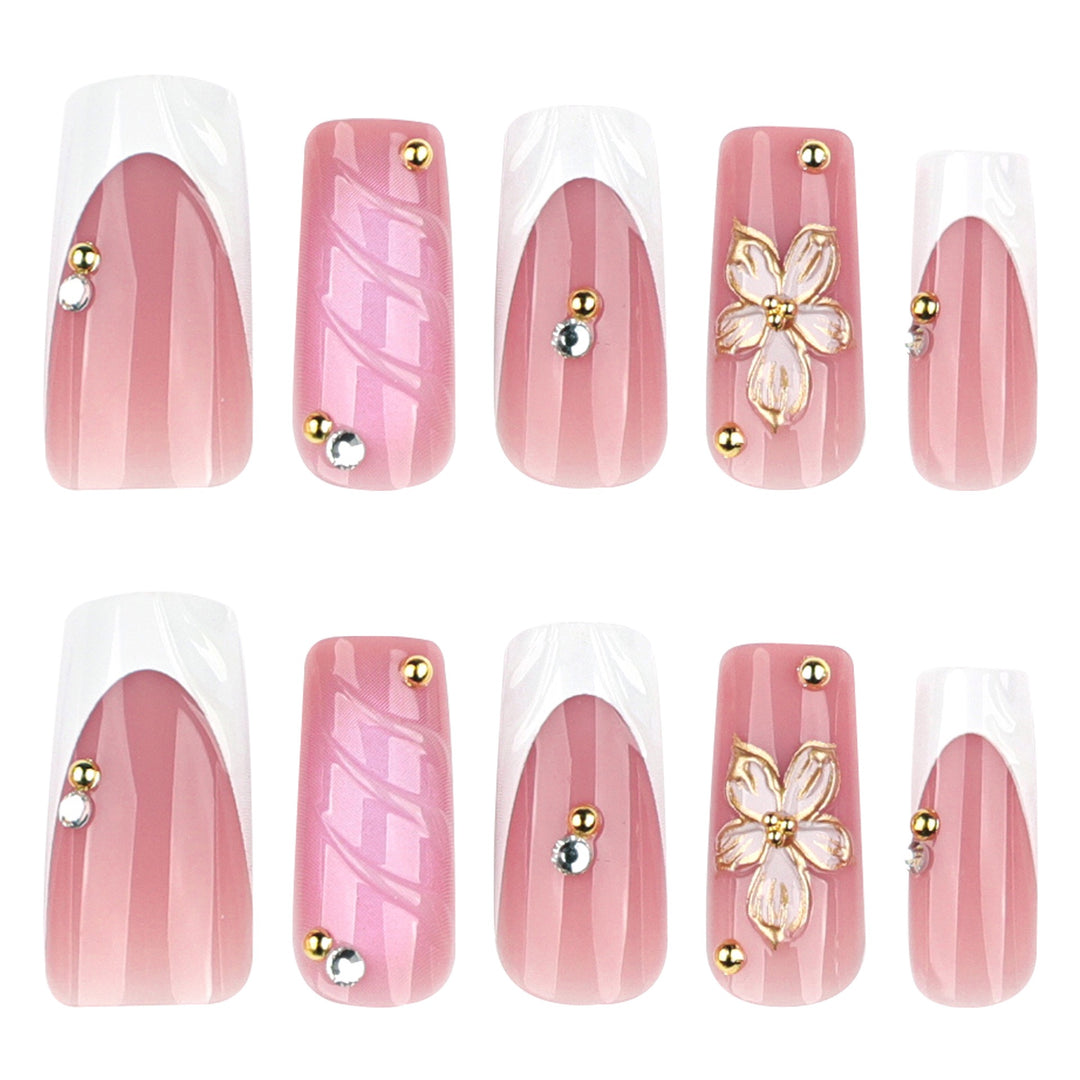 nchanted Elegance medium almond bridal press-on nails featuring white French tips decorated with 3D white bows, pearls, and crystal rhinestones.