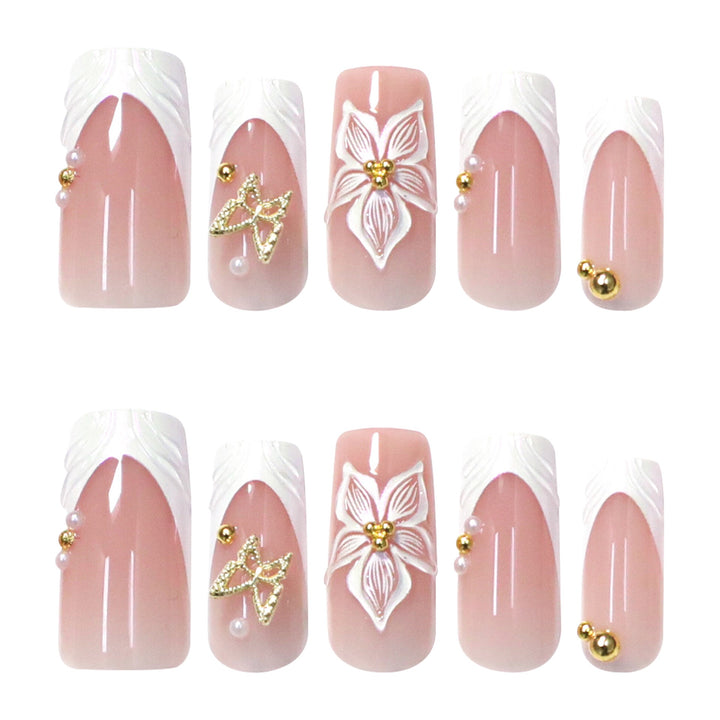 Petal Pathway medium almond bridal press-on nails featuring a translucent milky white base detailed with abstract white swirl line art and wavy squiggles.