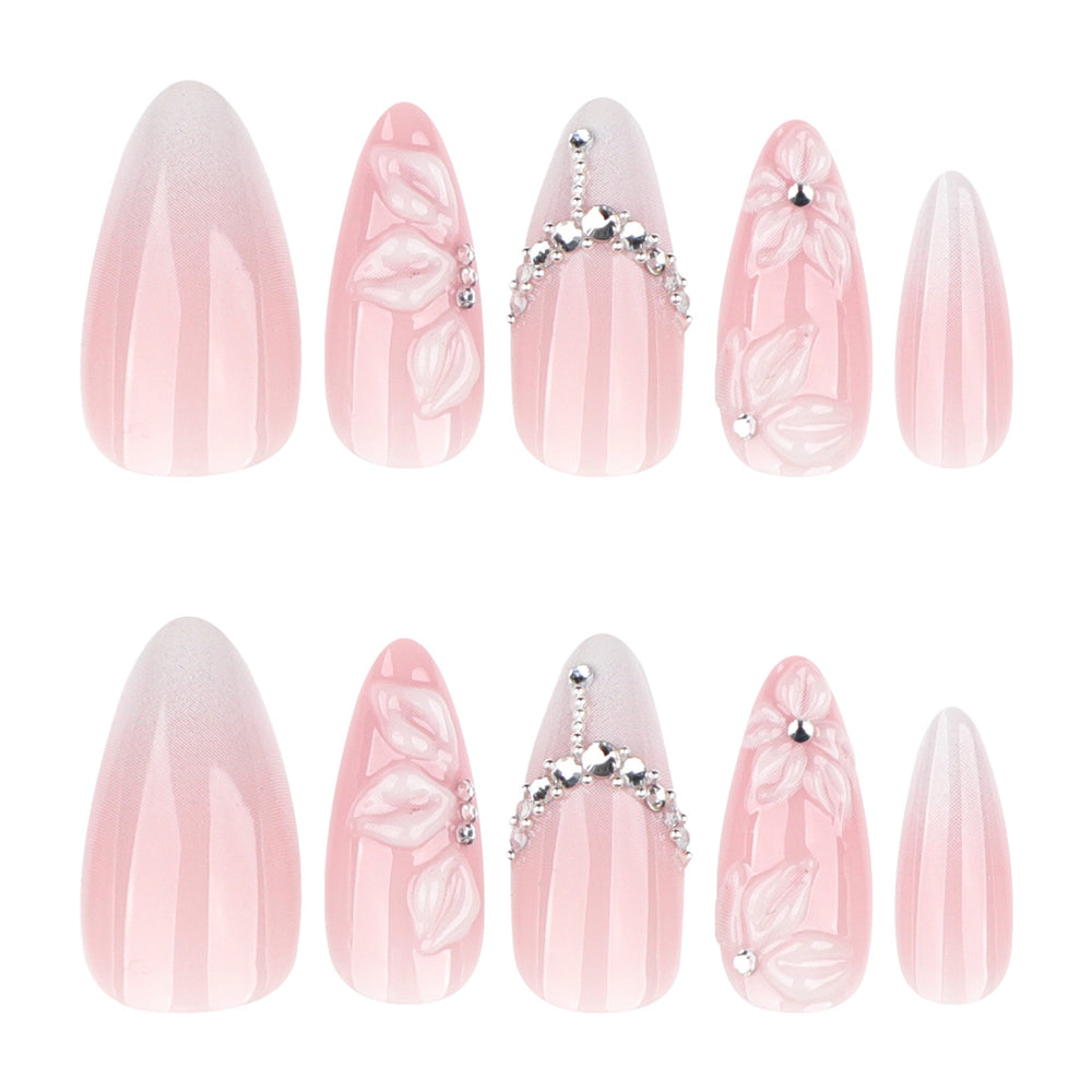 Quiet Vows medium almond press-on nails featuring a sheer pink base, white French tips, and a centered  silver rhinestone cluster near the cuticle.