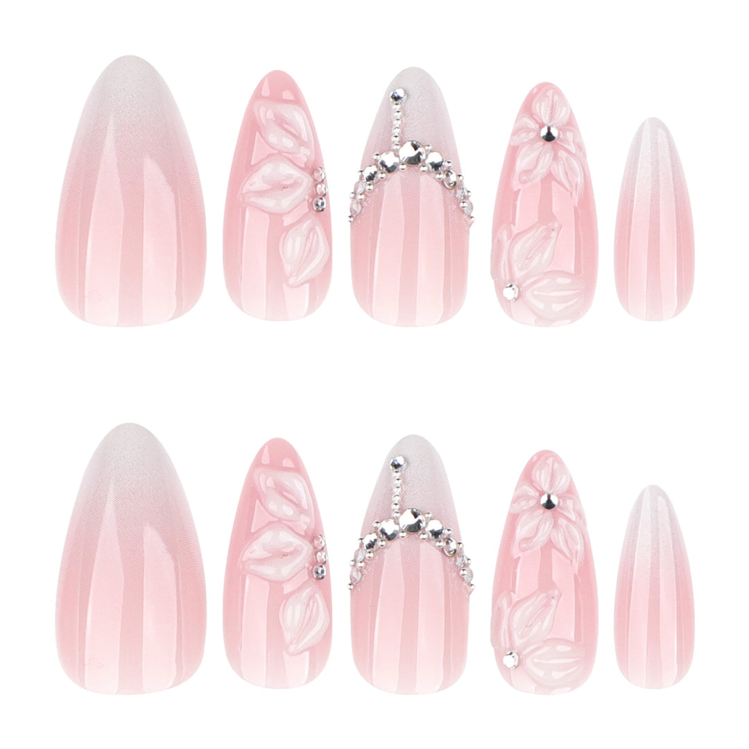 Quiet Vows medium almond press-on nails featuring a sheer pink base, white French tips, and a centered  silver rhinestone cluster near the cuticle.