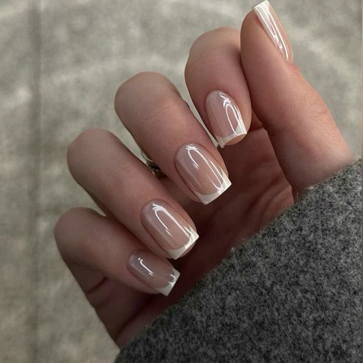 Vanilla Glaze French short square press-on nails featuring a luminous iridescent pearlescent pink base with white French tips and a glazed donut chrome finish.